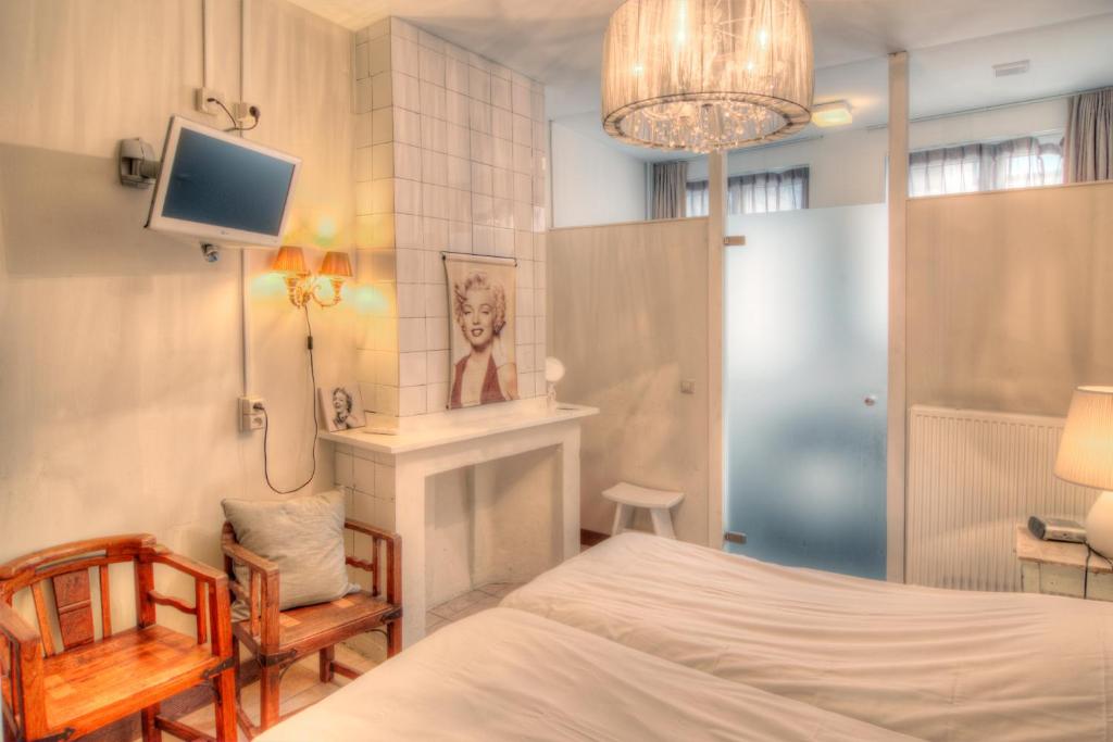 Llit o llits en una habitació de Hotel Urban Dreams