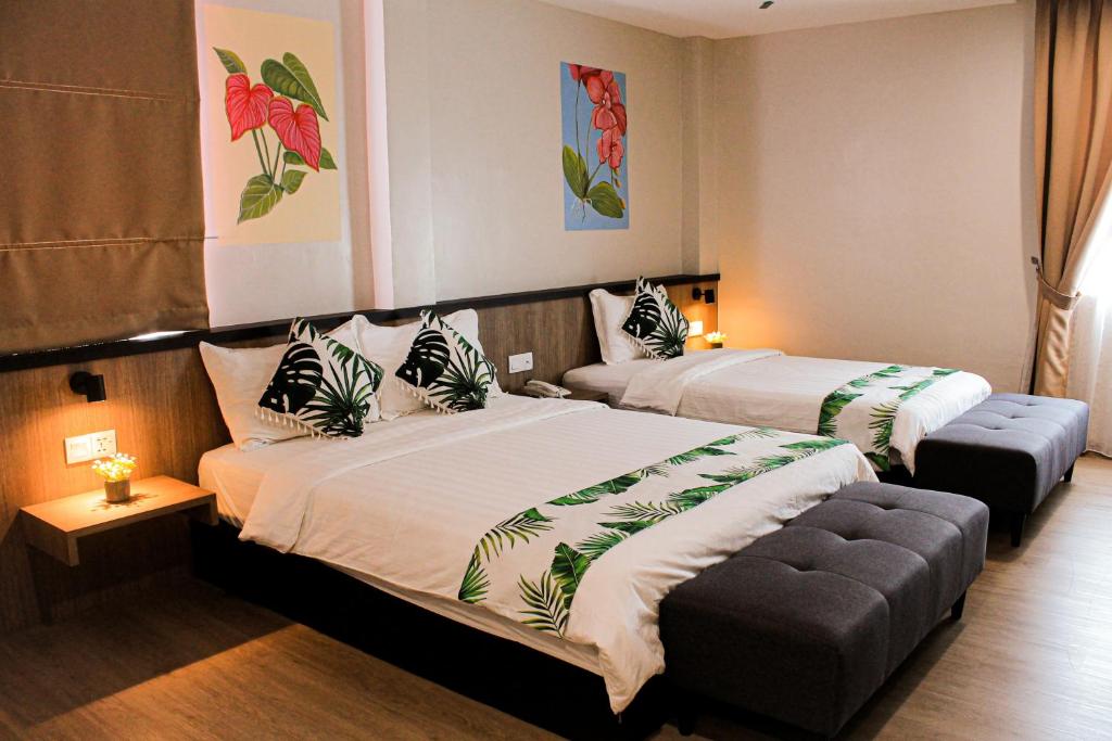 Giường trong phòng chung tại Savana Hotel & Serviced Apartments