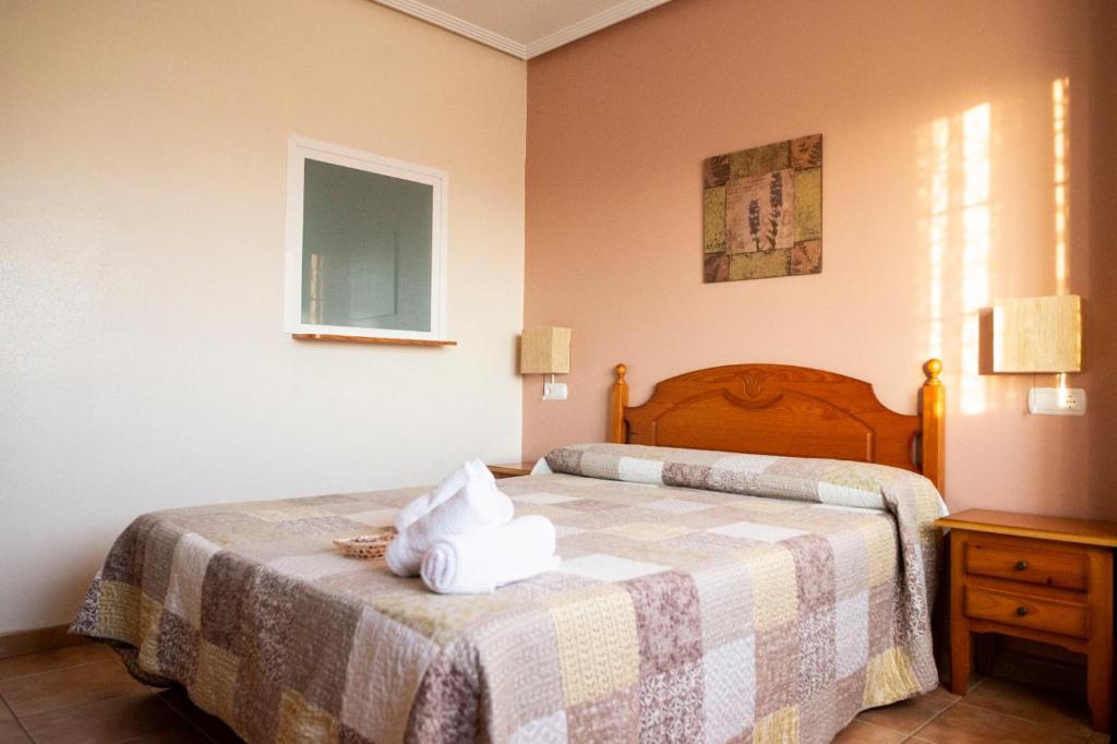 Postel nebo postele na pokoji v ubytování El Cordobés , alojamiento y habitaciones