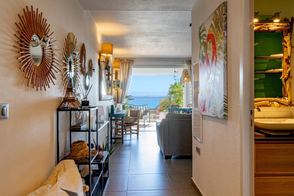 a living room with a view of the ocean at Bleu Marine Beach in Grand Case
