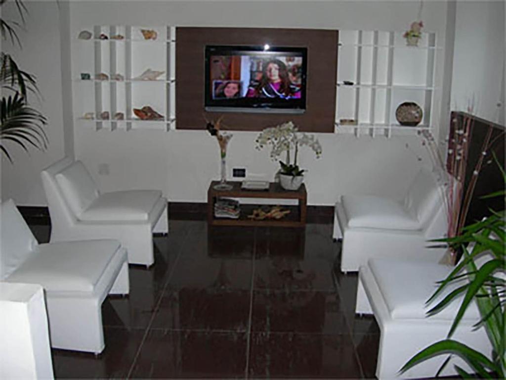 TV a/nebo společenská místnost v ubytování Pansini Hotel Residence
