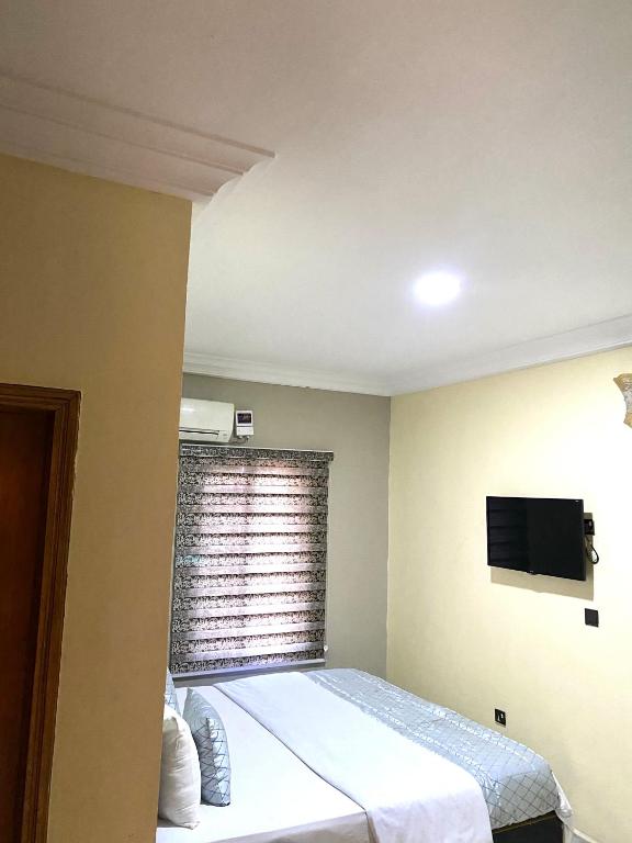 Postel nebo postele na pokoji v ubytování Nue-Crest Hotels & Suites