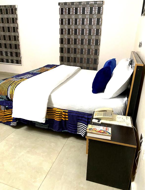 Postel nebo postele na pokoji v ubytování Nue-Crest Hotels & Suites