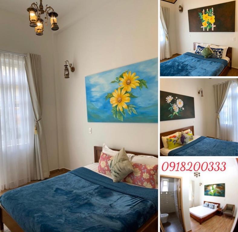 a room with two beds and a painting on the wall at De Daisy Villa Homestay in Da Lat