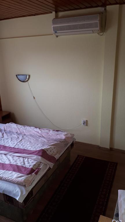 Postel nebo postele na pokoji v ubytování Napsugár Panzió