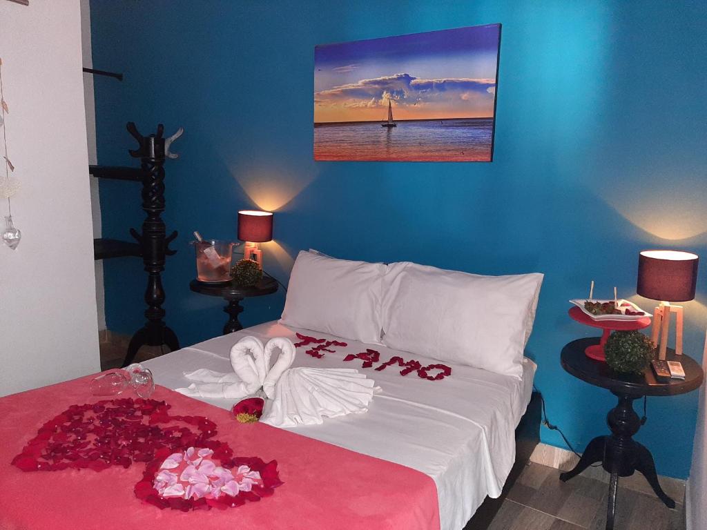 Postel nebo postele na pokoji v ubytování Hotel Sunset Beach
