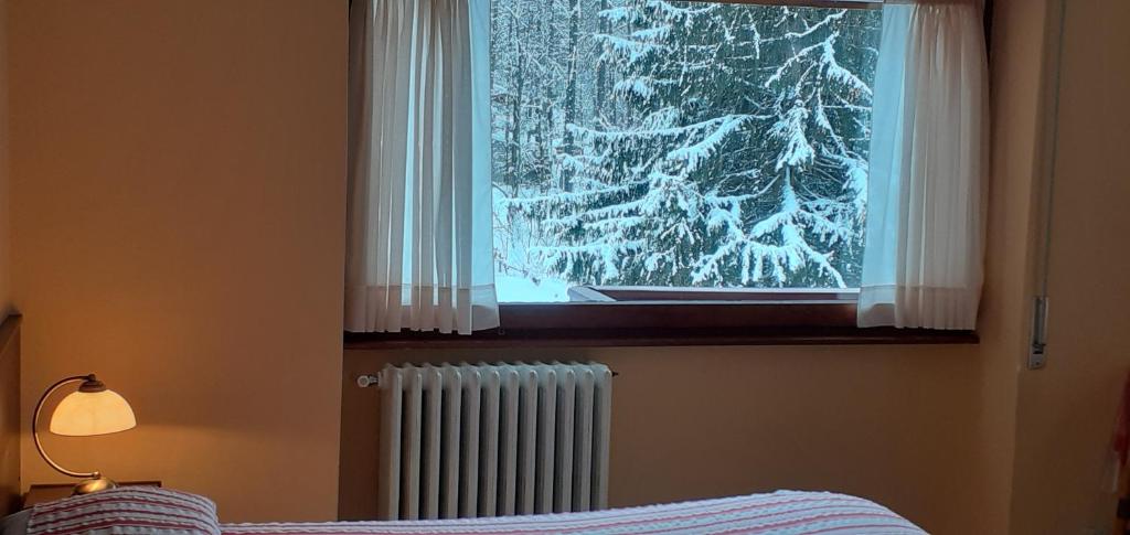 Postel nebo postele na pokoji v ubytování Hotel Cristallo