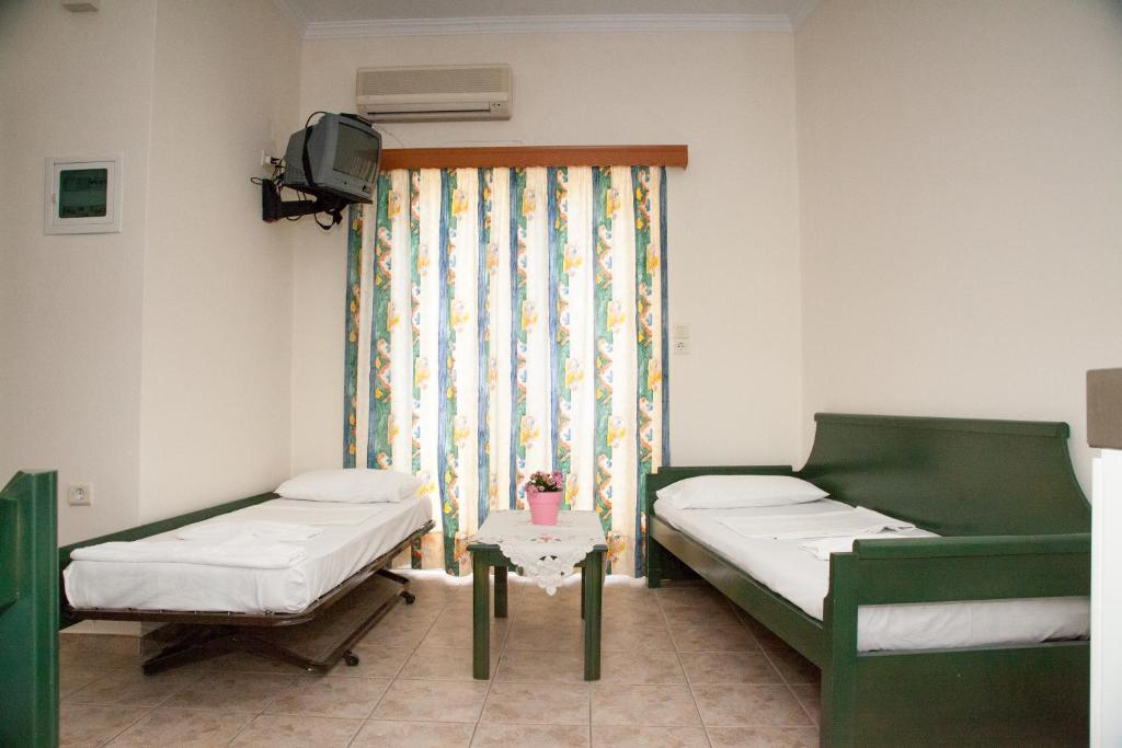 Postel nebo postele na pokoji v ubytování Meandros