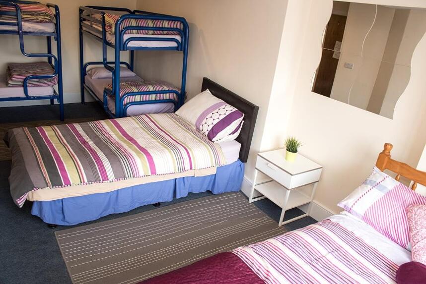 Postel nebo postele na pokoji v ubytování Sive Budget Accommodation