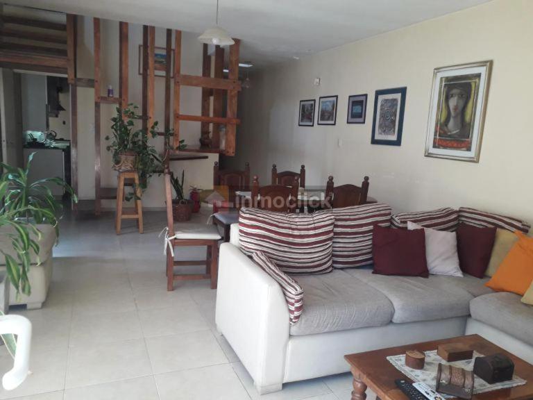 a living room with a couch and a table at Habitaciones confortables con baño privado in San Rafael