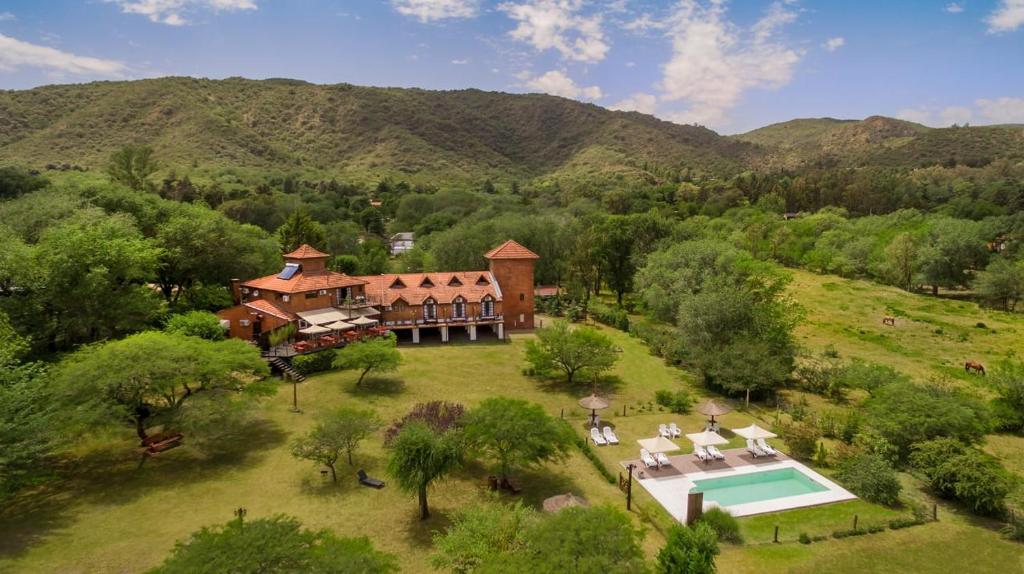 an aerial view of a house with a swimming pool at Posada de Campo - Hotel Boutique - Adults Only in Villa General Belgrano