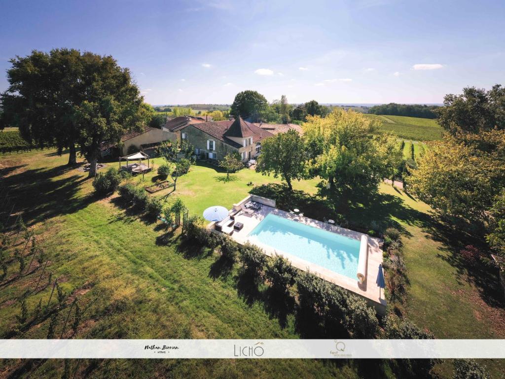 an aerial view of a house with a swimming pool at Maison des Quatre Saisons in Les Esseintes