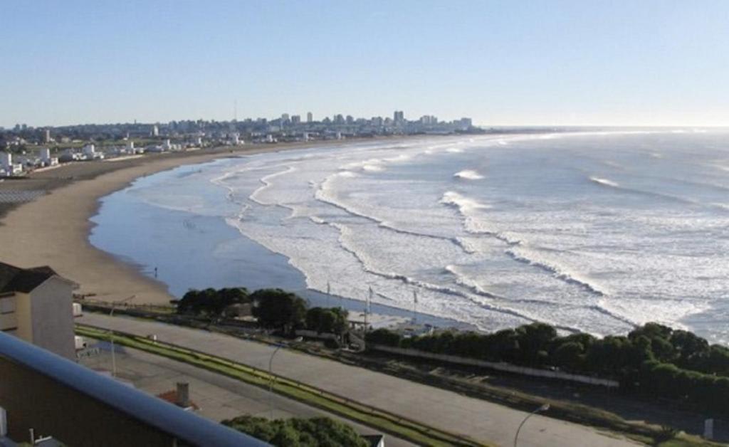 a view of the beach from a balcony at Solanas Playa Mar del Plata in Mar del Plata