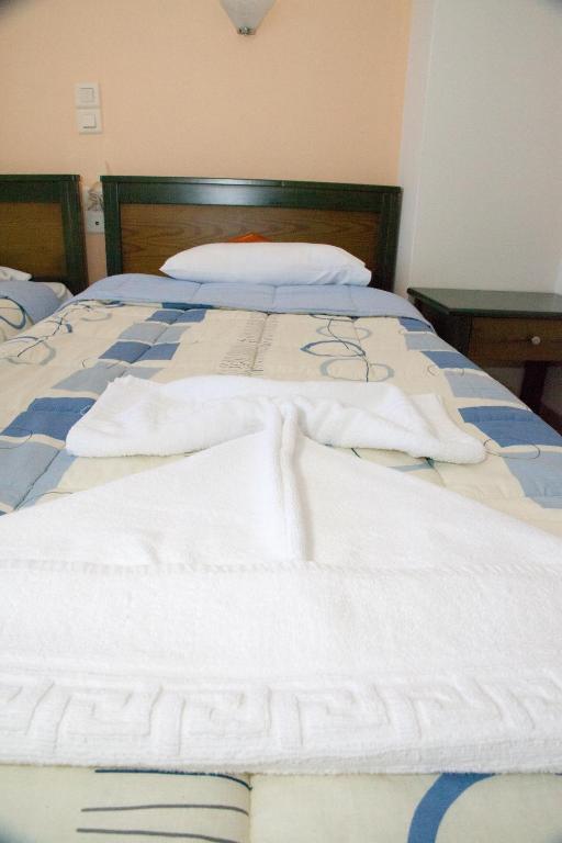 Postel nebo postele na pokoji v ubytování Meandros