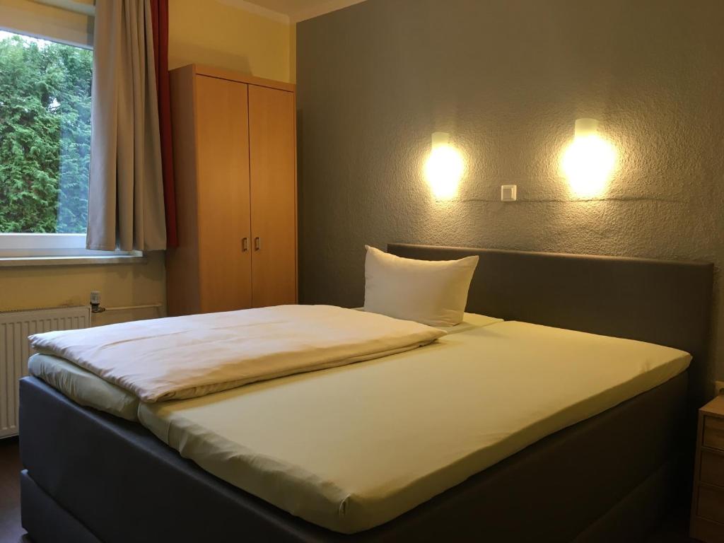 Postel nebo postele na pokoji v ubytování Hotel Sieme