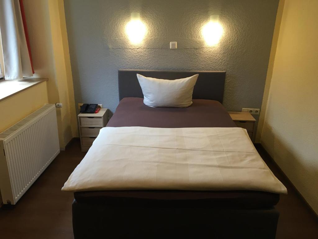 Postel nebo postele na pokoji v ubytování Hotel Sieme