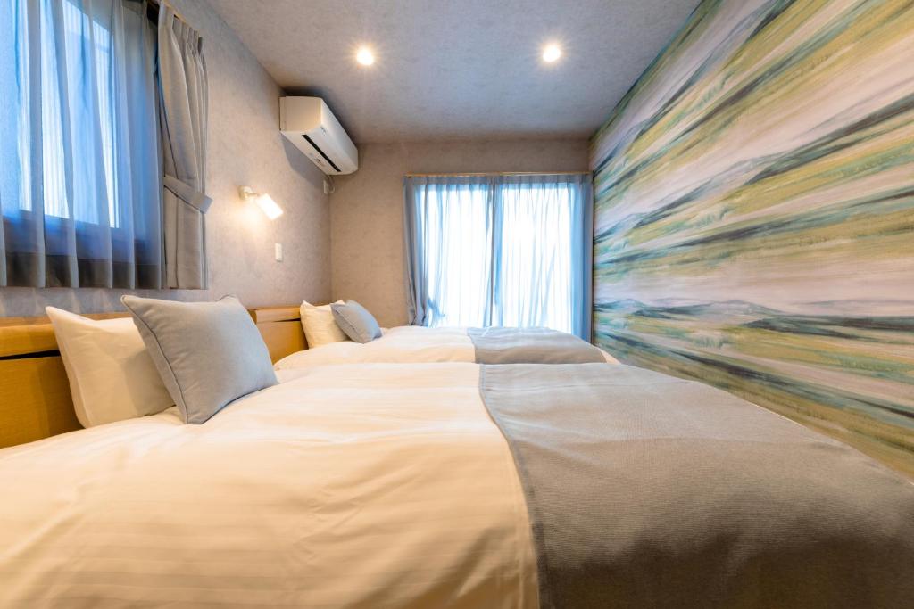 Postel nebo postele na pokoji v ubytování 02 Resort Club -蒼SOU-