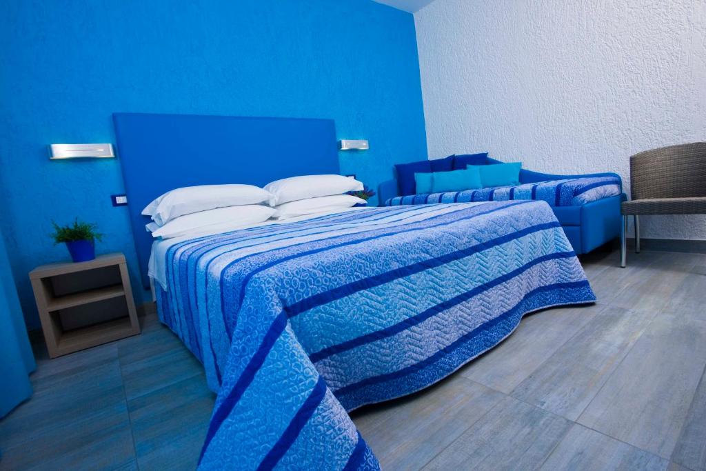 Кровать или кровати в номере Hotel Napoleon