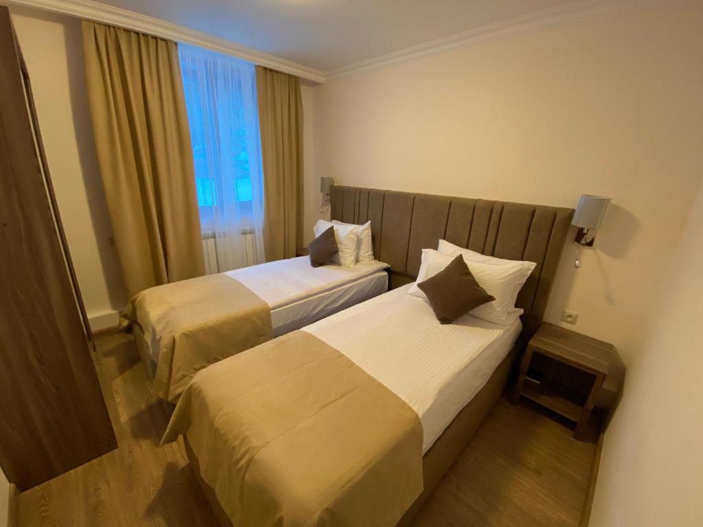 Postel nebo postele na pokoji v ubytování Alva Hotel & Spa