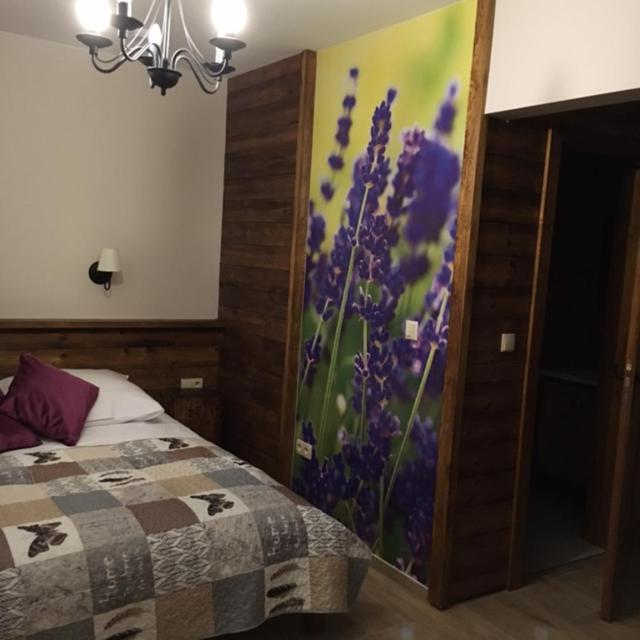Postel nebo postele na pokoji v ubytování Folwark Pod Dębem