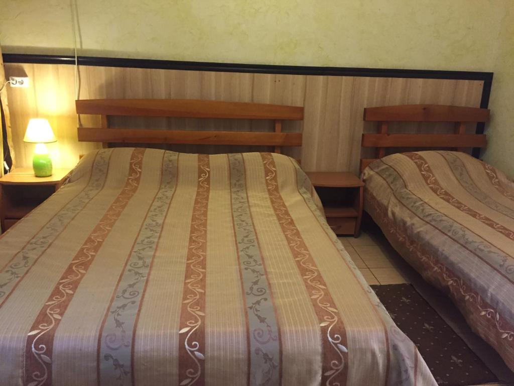 Postel nebo postele na pokoji v ubytování Kazka