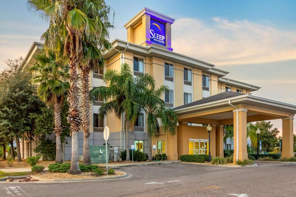 a hotel with a sign on top of it at Sleep Inn & Suites - Jacksonville in Jacksonville