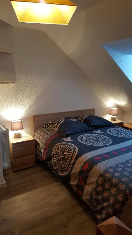 Postel nebo postele na pokoji v ubytování Duplex Métabief