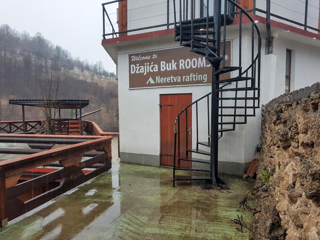 un edificio con un cartel en el costado en Captain s house, en Konjic