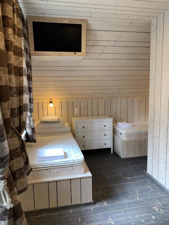 Postel nebo postele na pokoji v ubytování Peipsi Homestay