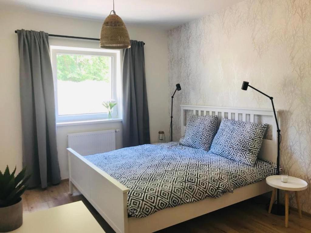 Postel nebo postele na pokoji v ubytování Apartmány Trio Krkonoše
