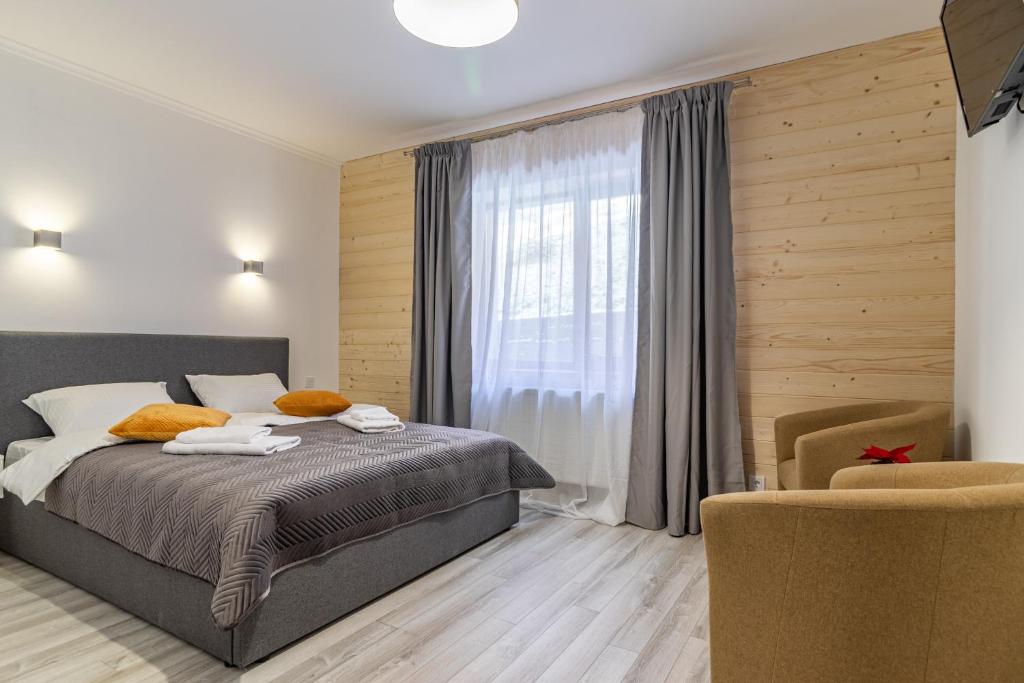 Postel nebo postele na pokoji v ubytování Konopka Forest Home & SPA