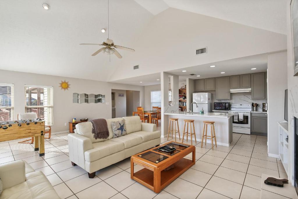 a living room with a couch and a table at The Vista of Palm Beach in Galveston