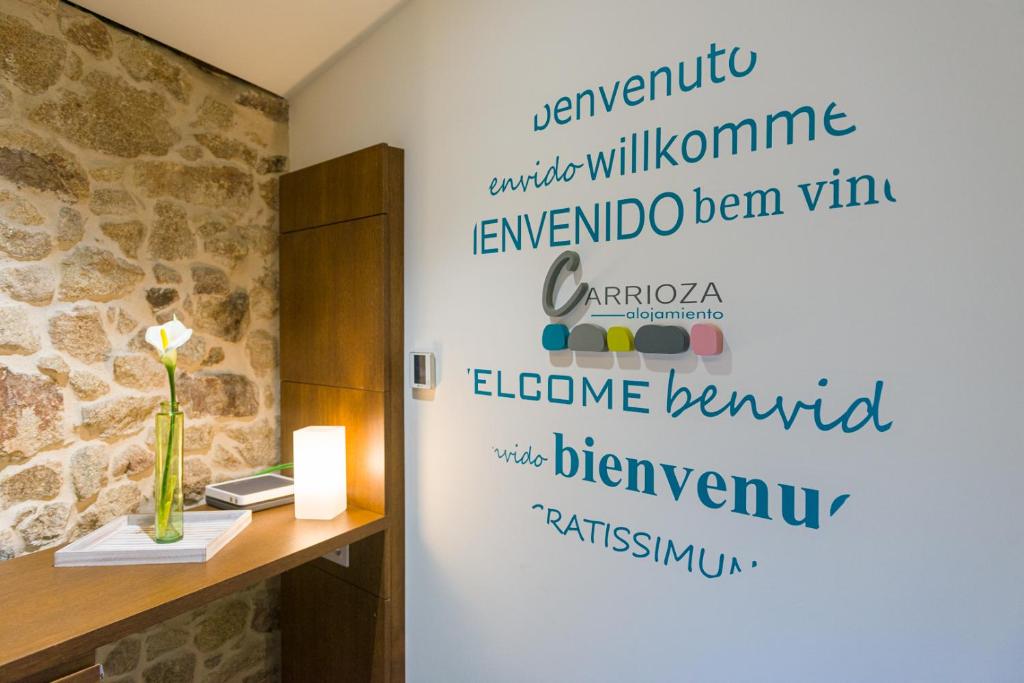 a wall with writing on it in a room at Carrioza Alojamiento Turístico in Parada del Sil