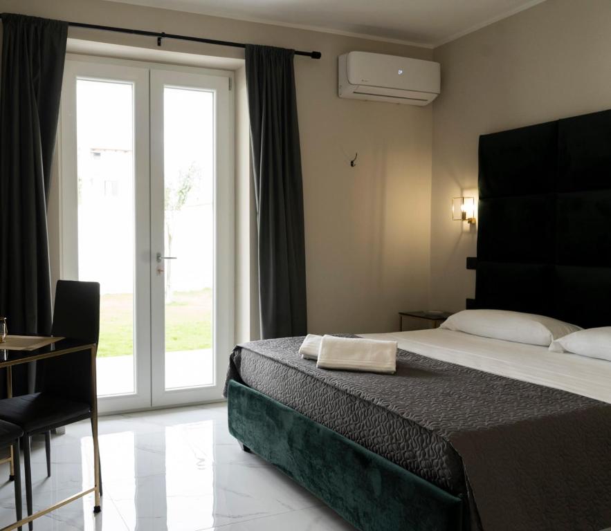 Postel nebo postele na pokoji v ubytování Hotel Elite
