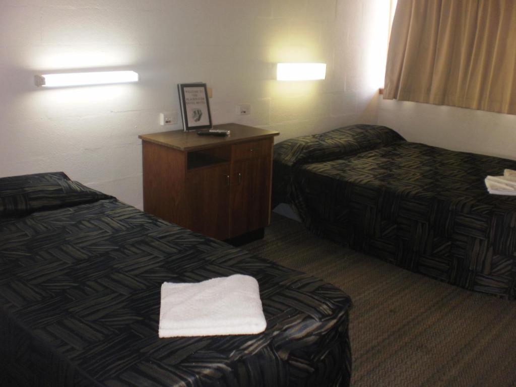 Postel nebo postele na pokoji v ubytování Blackwater Hotel Motel