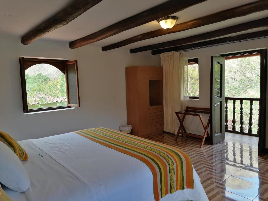 Postel nebo postele na pokoji v ubytování Utcubamba River Lodge