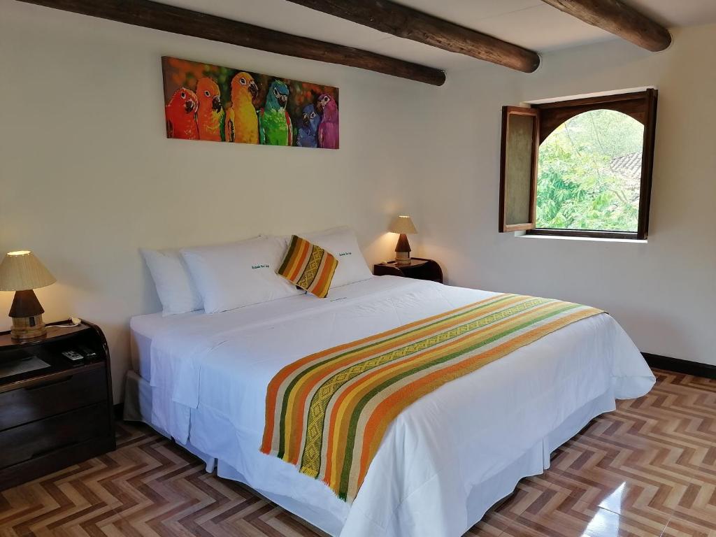 Postel nebo postele na pokoji v ubytování Utcubamba River Lodge