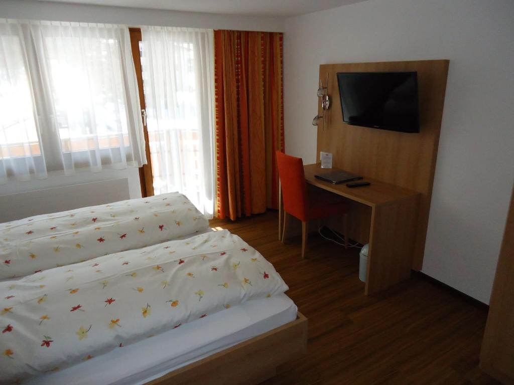 Postel nebo postele na pokoji v ubytování Hotel Monte-Moro
