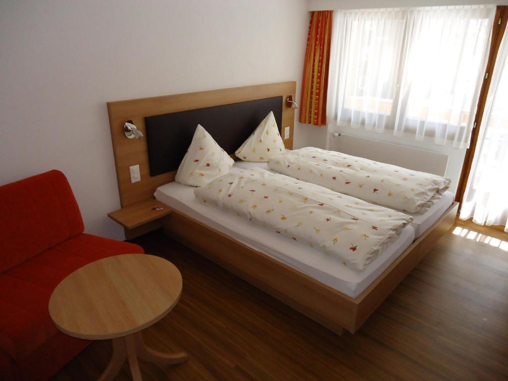 Postel nebo postele na pokoji v ubytování Hotel Monte-Moro