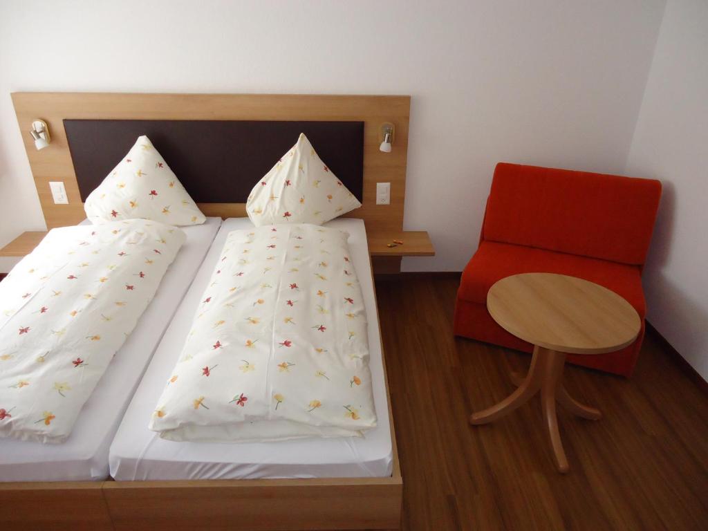 Postel nebo postele na pokoji v ubytování Hotel Monte-Moro