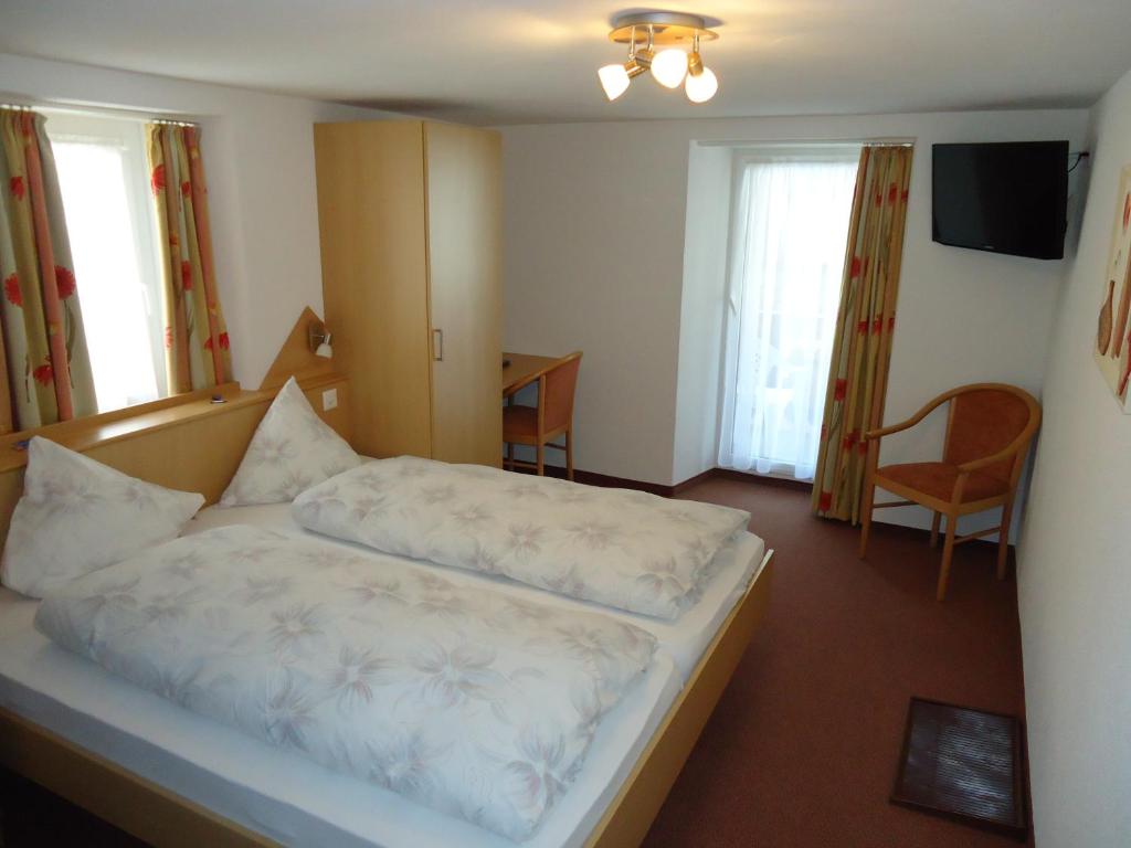Postel nebo postele na pokoji v ubytování Hotel Monte-Moro