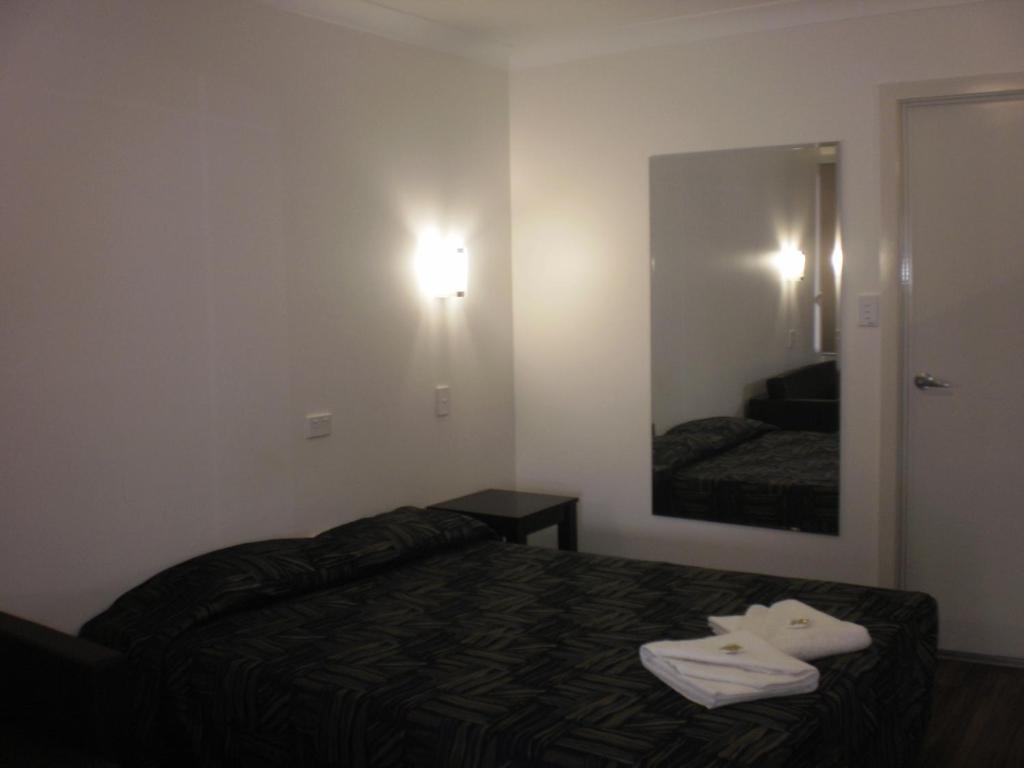 Postel nebo postele na pokoji v ubytování Blackwater Hotel Motel