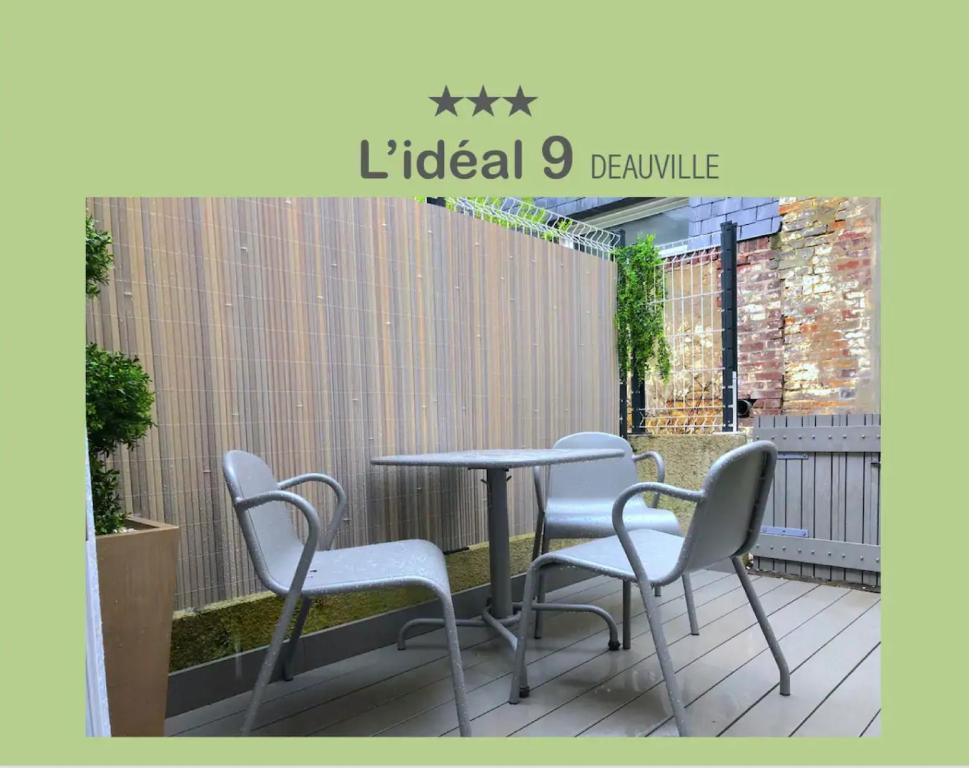 a table and chairs sitting on a patio at L'IDEAL 9 (hypercentre avec terrasse) in Deauville