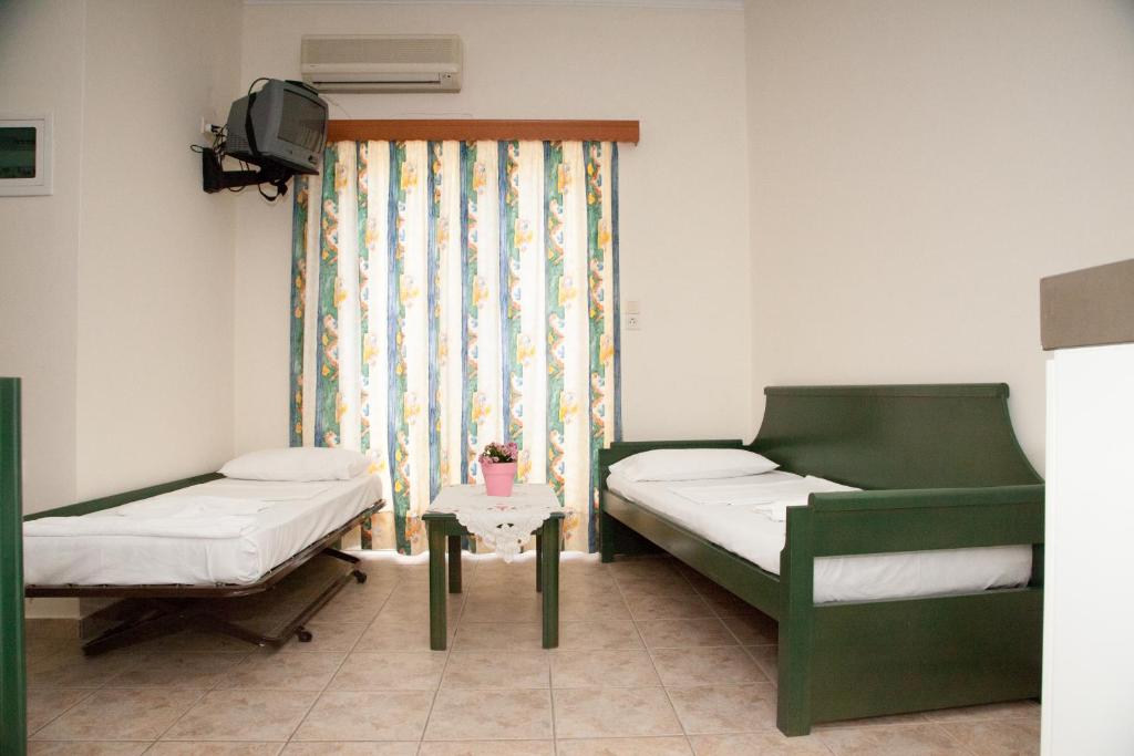 Postel nebo postele na pokoji v ubytování Meandros