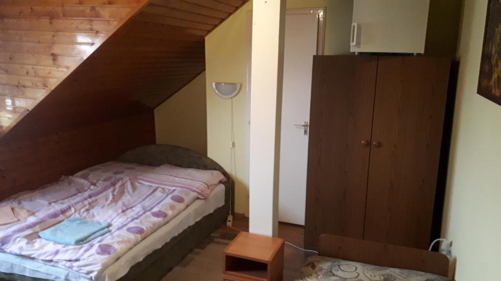 Postel nebo postele na pokoji v ubytování Napsugár Panzió