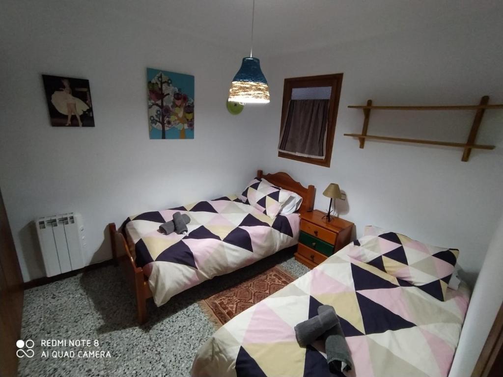 Postel nebo postele na pokoji v ubytování Cal Jardiner