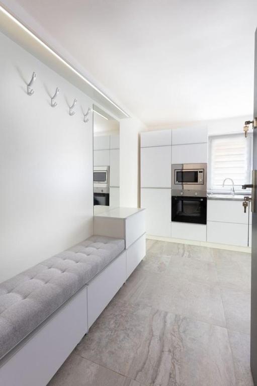 Kuchyň nebo kuchyňský kout v ubytování Trend Apartmanház -Vizslás