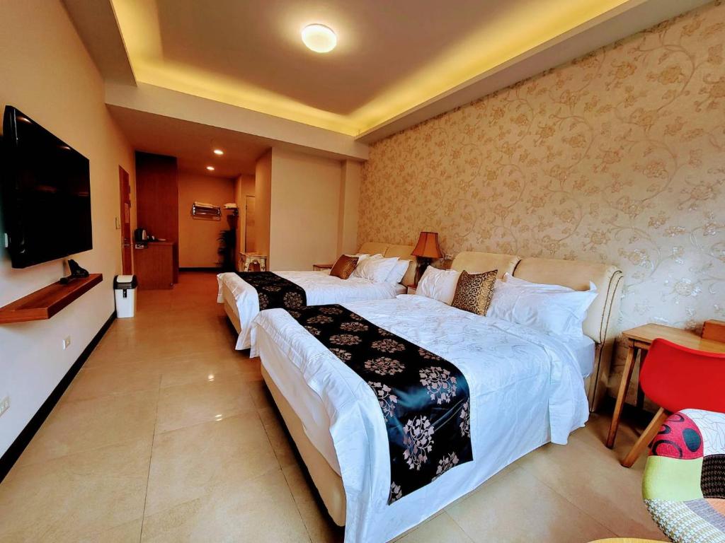 Krevet ili kreveti u jedinici u okviru objekta 山水奇異San Shuei Kiwi桃園市民宿編號038 Homestay