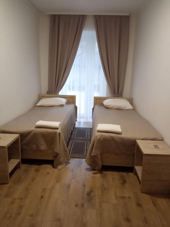 Postel nebo postele na pokoji v ubytování Hotel Bonus