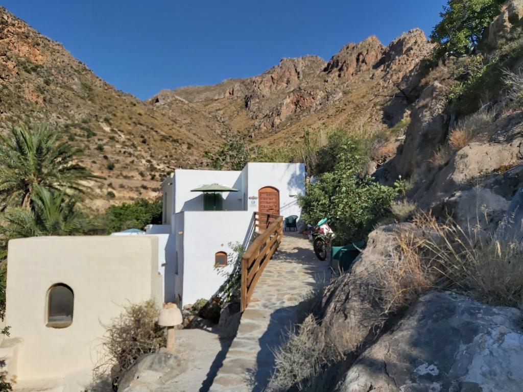 a house on the side of a mountain at Cortijo El Molino Apartamento"El balconcito" in Níjar